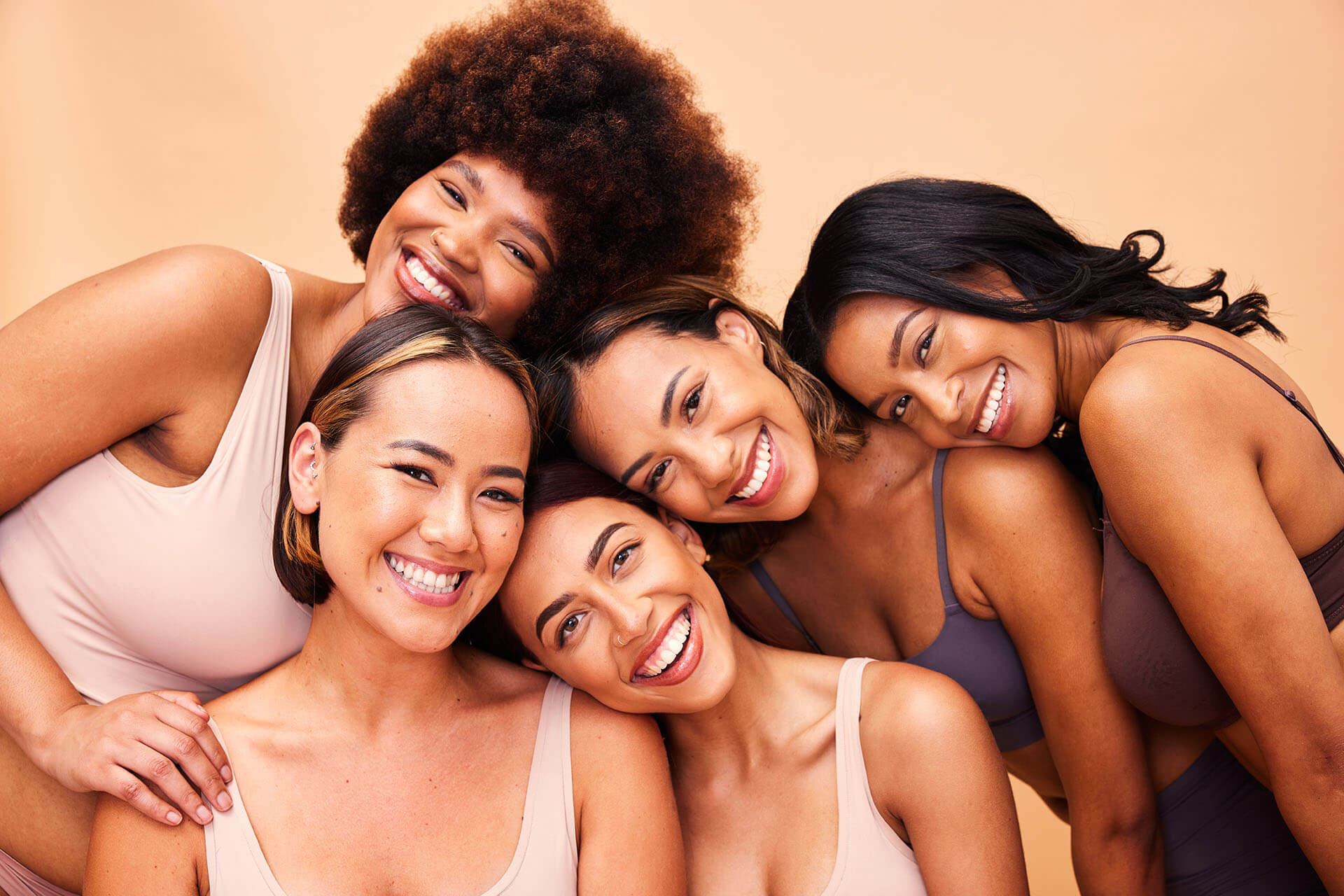 A group of women smiling together
